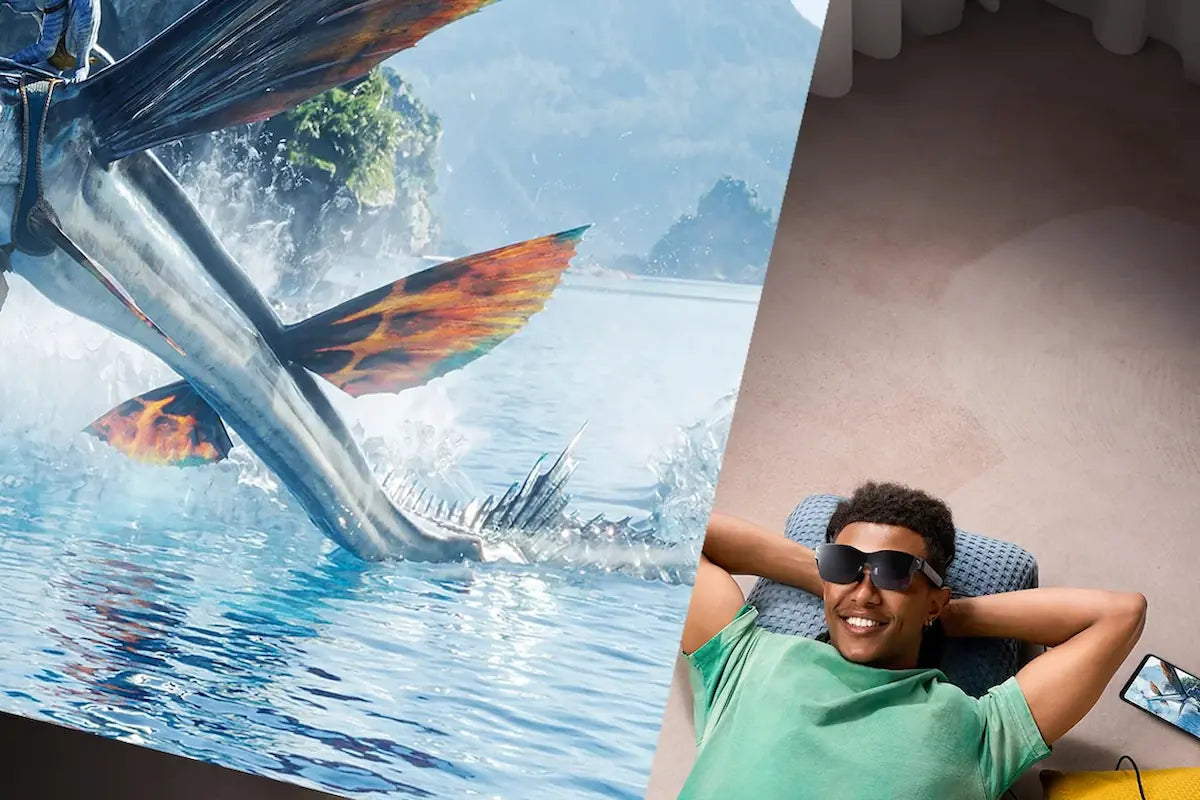 A viewer relaxing with AR glasses beside an immersive underwater virtual screen.